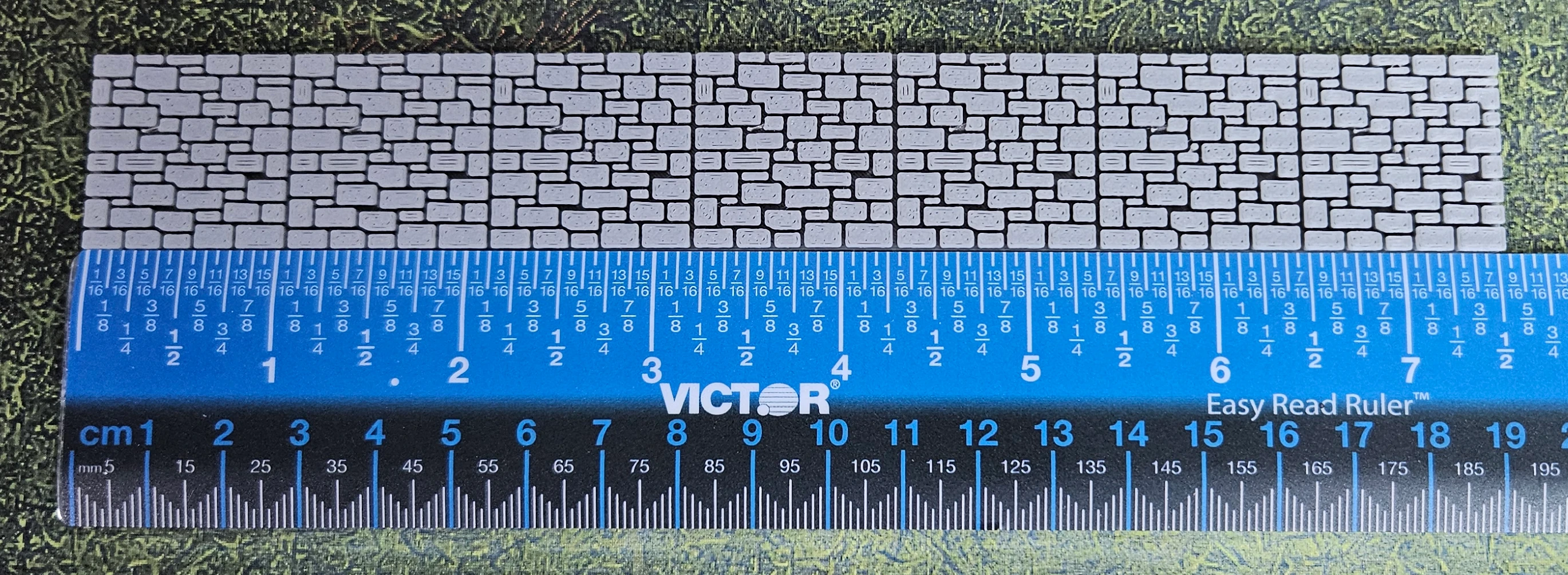 Close view of the stone texture on an HO scale wall