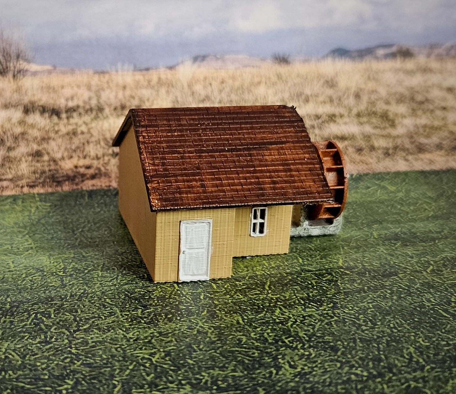 HO scale working waterwheel with a large building