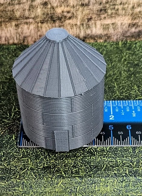 N scale grain silos displayed in a model railroad scene