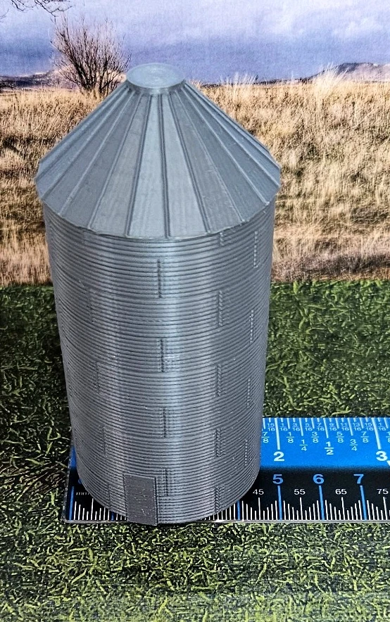 N scale grain silos displayed together in a model railroad scene