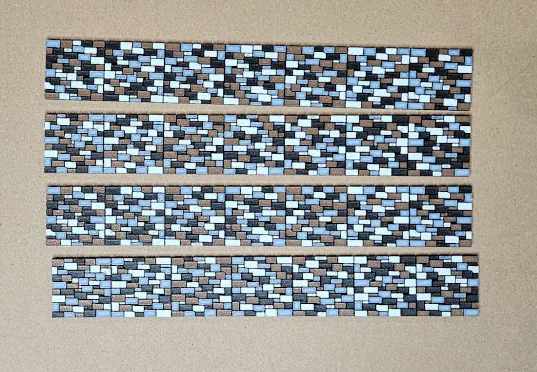 Four natural stone color HO scale wall sections arranged in parallel