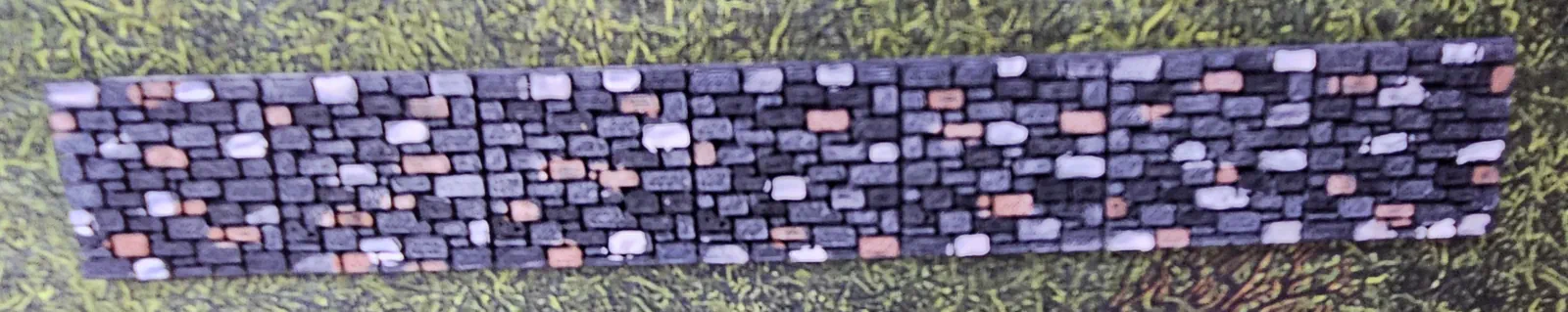 Natural stone color HO scale wall gently curved to demonstrate flexibility
