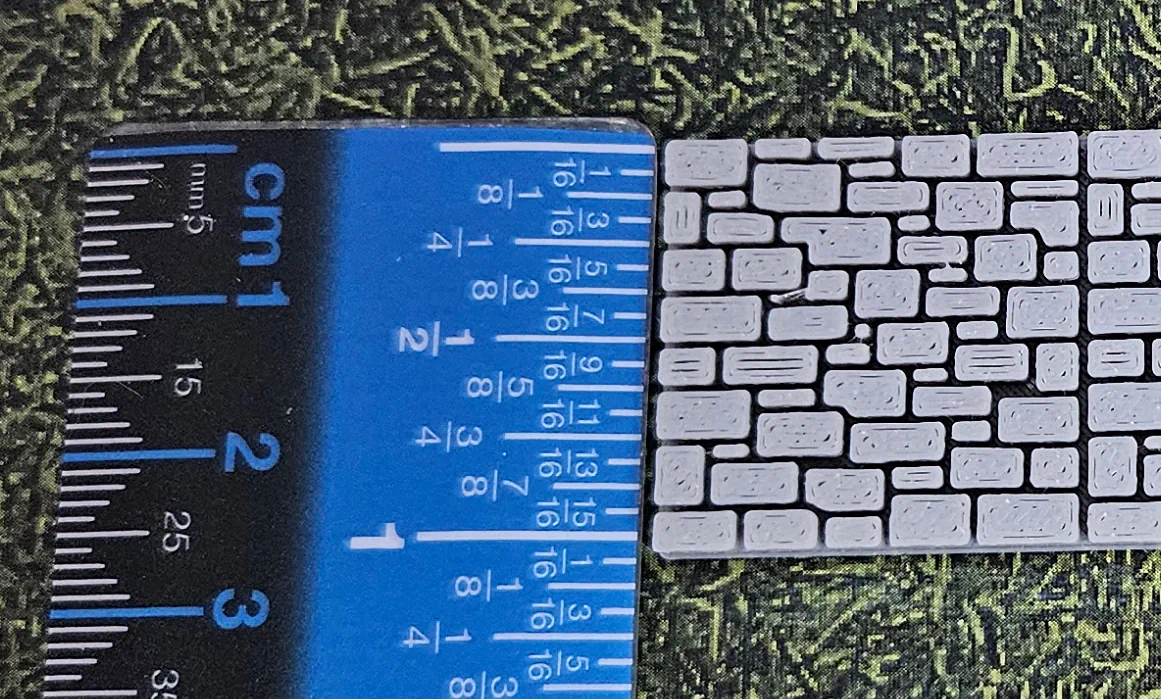 Solid gray HO scale stone wall measured at approximately 26 millimeters high