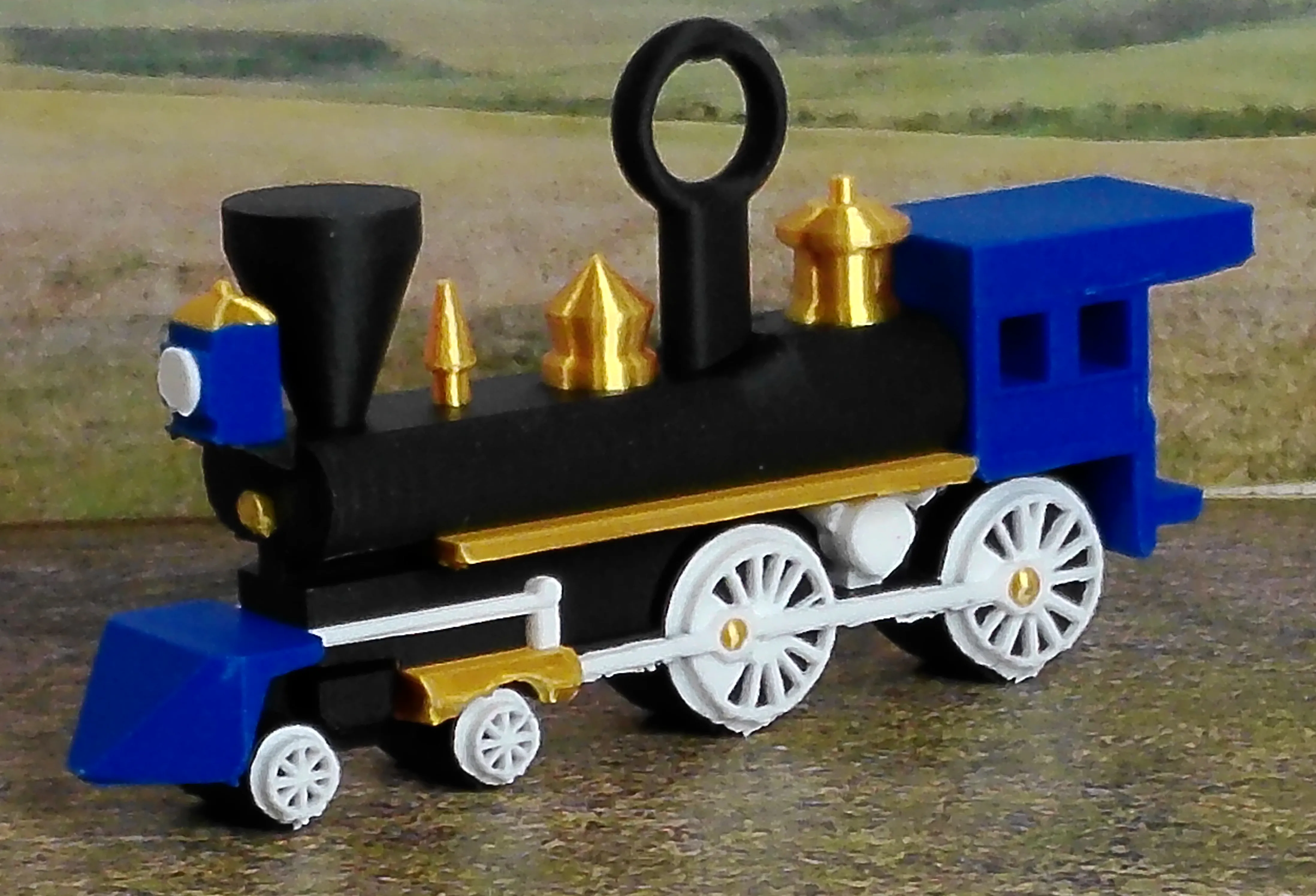 Blue steam locomotive Christmas ornament viewed from the front at an angle