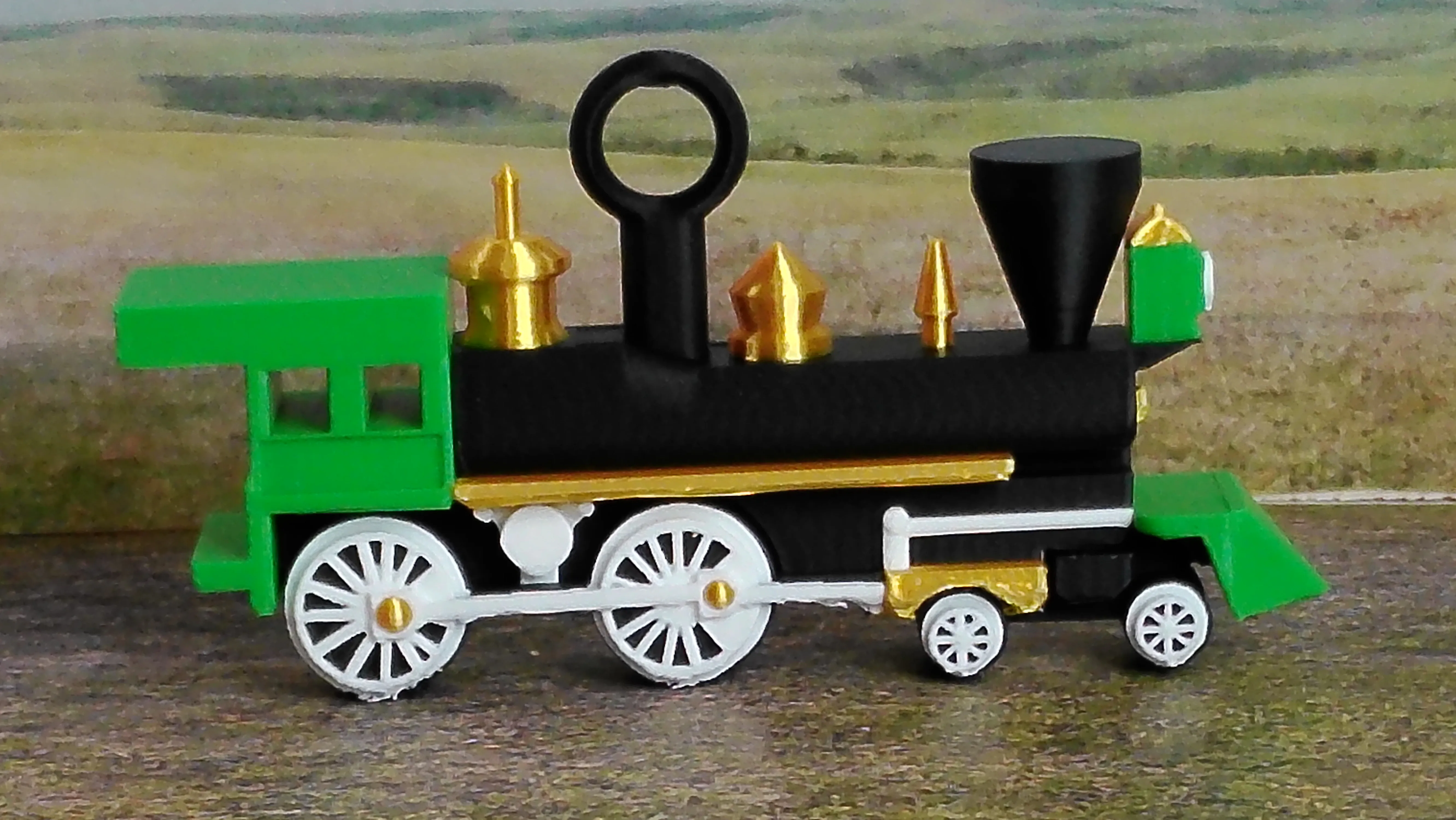 Green steam locomotive Christmas ornament viewed from the side