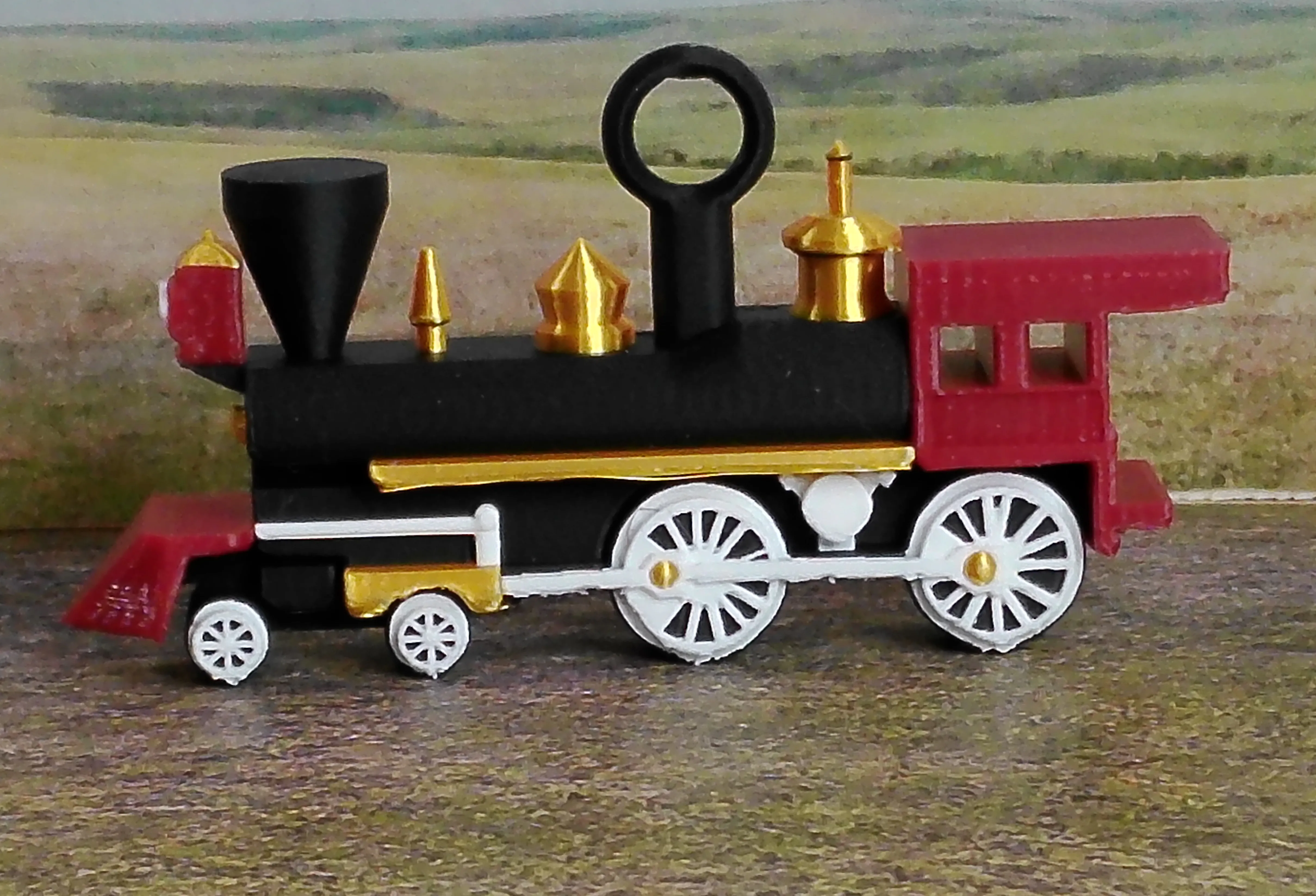 Red steam locomotive Christmas ornament viewed from the side