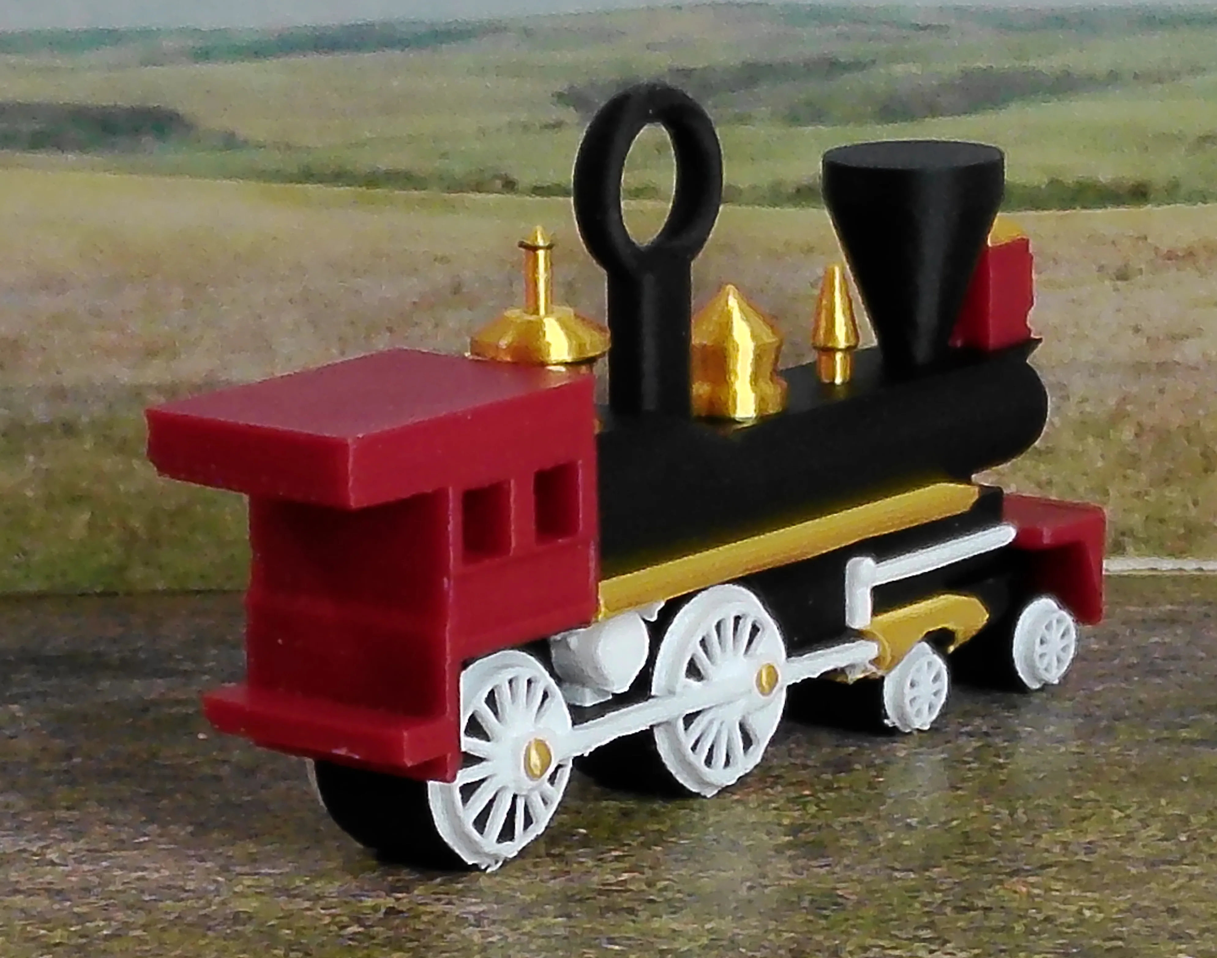Red steam locomotive Christmas ornament viewed from the rear at an angle